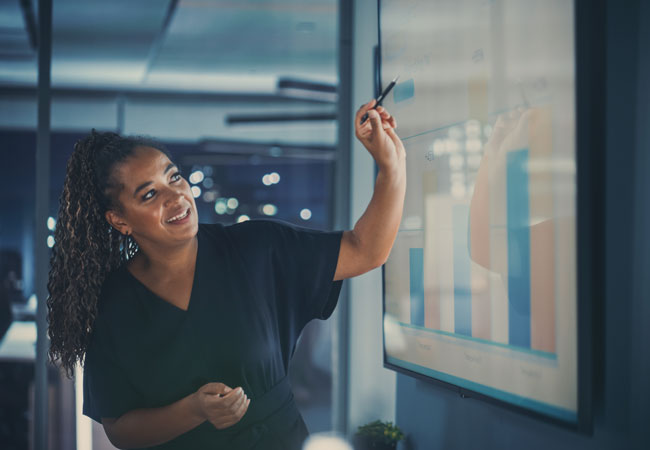 Woman presenting a colorful chart in meeting