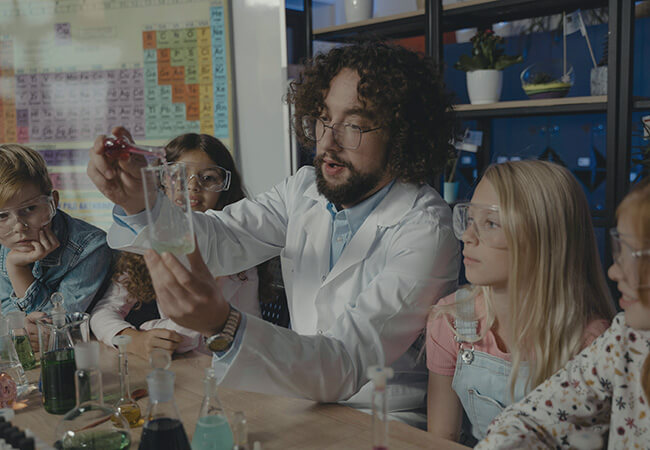 Teacher doing a science experiment with kids