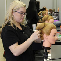 Amber Ortiz styling a manequins hair