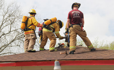 Firefighters on a roof