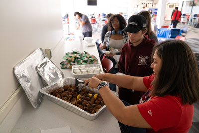 Students eating food at dominican event