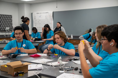 Students at table building projects