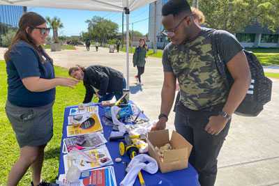 Students outside at a geology table